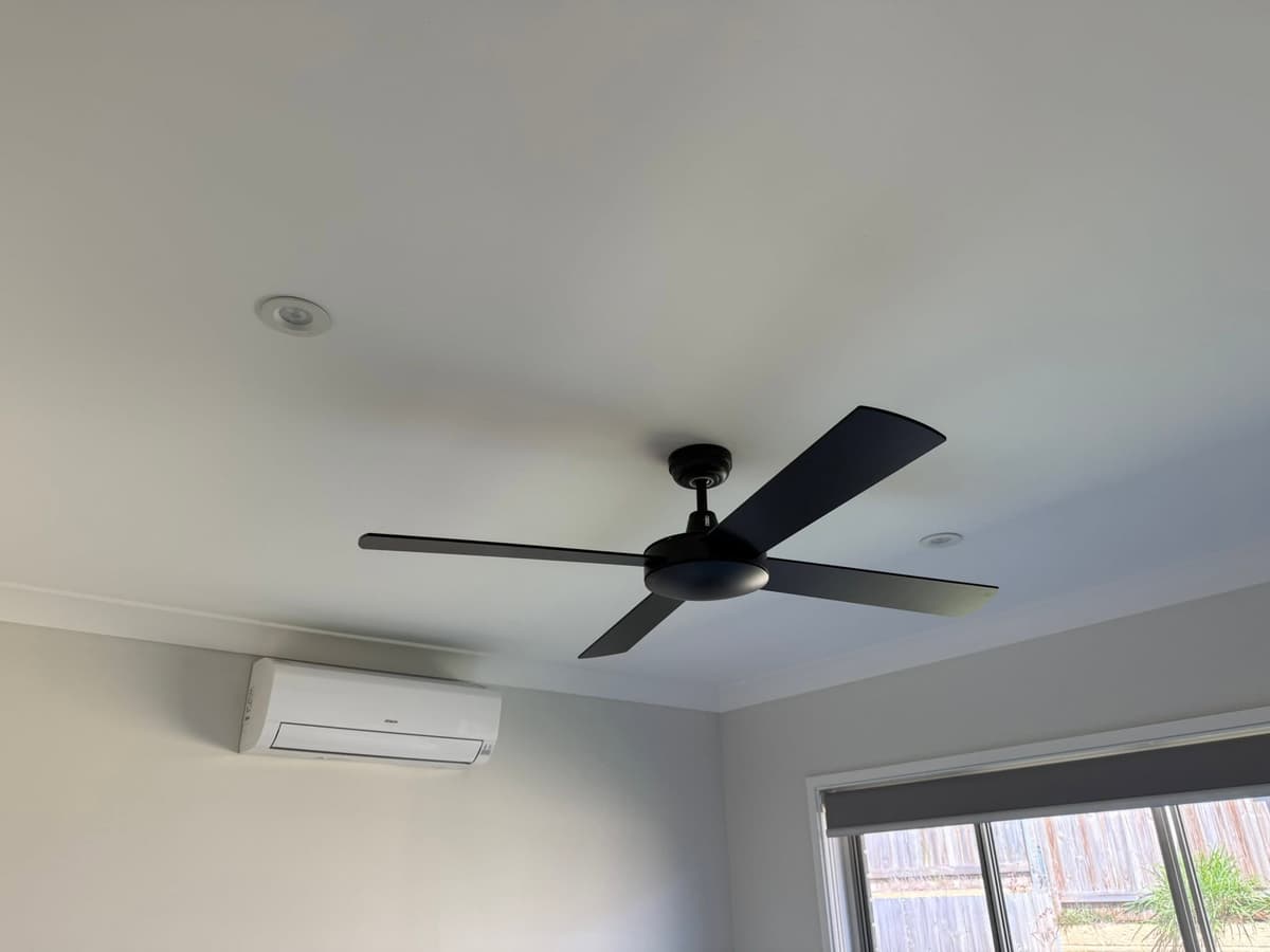 Black ceiling fan and split system power in a renovated bedroom, Logan City